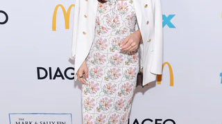 What is the necklace that Kaitlan Collins' wearing?